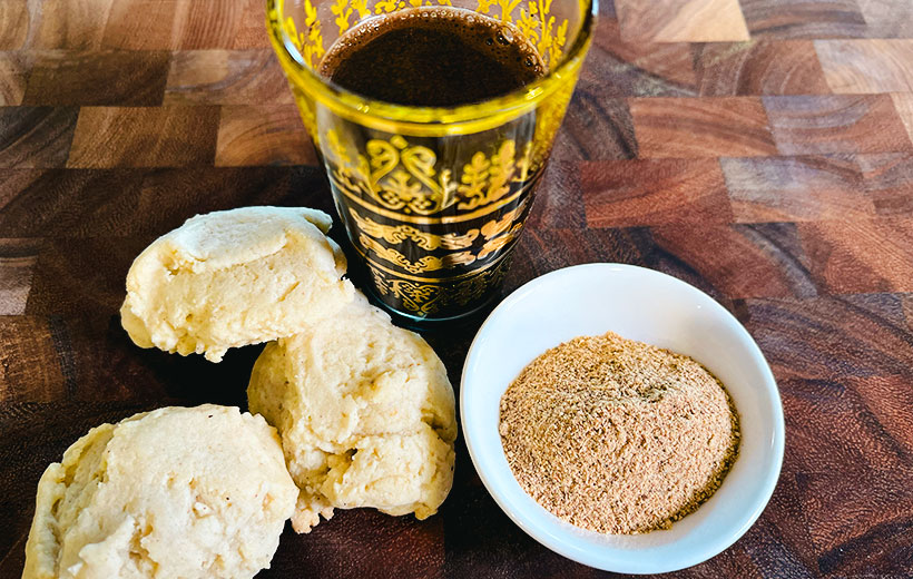 Sugar cookies baked with Mediterranean twist of "Arabica Bake" spice blend. On the right, a small bowl with the coffee hawaij spice blend, and black Middle-Eastern coffee.